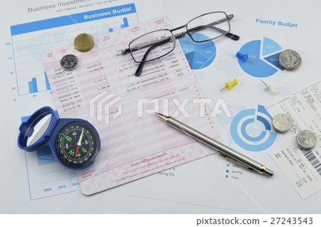 Compass, pen, glasses and coin on saving book Compass, pen, glasses and coin on saving book 27243543