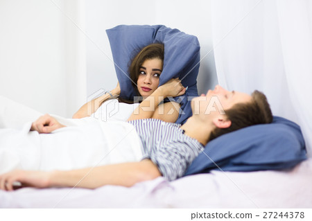 Man snoring in bed 27244378