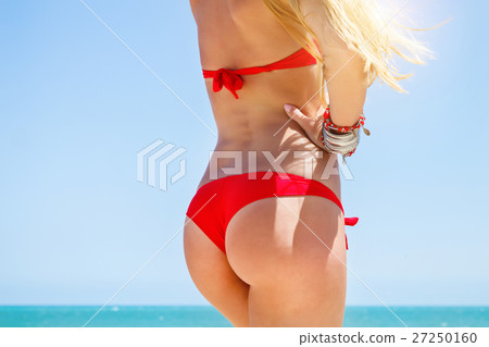 Beautiful woman in sexy bikini at the beach Beautiful woman in sexy bikini at the beach 27250160