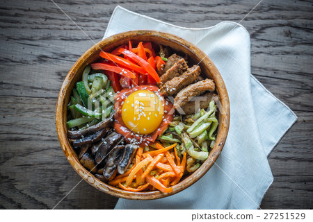 Bowl of bibimbap on the wooden table 27251529