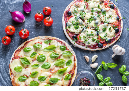 Two pizzas with ingredients  27251787