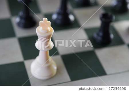 White chess king surrounded 27254698