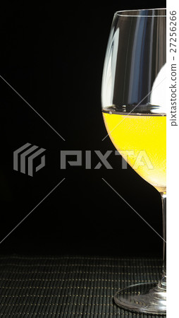 Wineglass with white wine 27256266