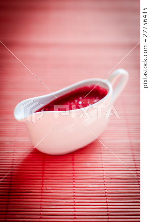 Sauce boat with red sauce Sauce boat with red sauce 27256415