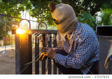 Man welding steel construction 27257635