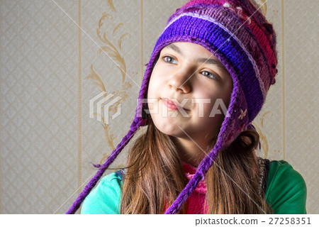 portrait of a 11 year old girl in a knitted cap 27258351