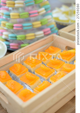piece of orange cake in wooden box at the party 27259160