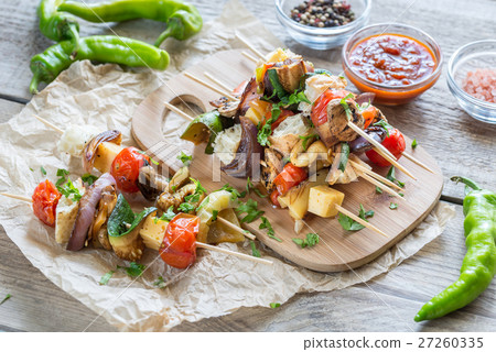 Grilled vegetable skewers on the wooden board 27260335