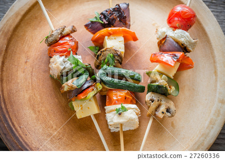 Grilled vegetable skewers on the plate 27260336