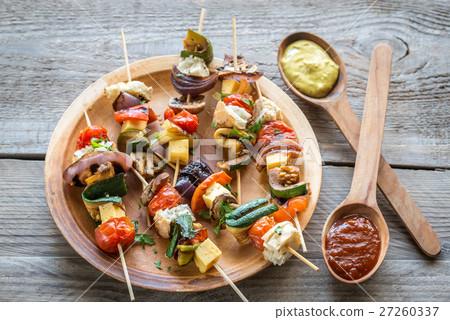 Grilled vegetable skewers on the plate 27260337