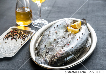 Fresh trouts in ice on the vintage metal tray Fresh trouts in ice on the vintage metal tray 27260410