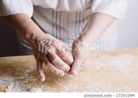 Two hands making meat dumplings. Two hands making meat dumplings. 27261094