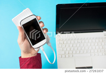 male hands holding a white cellphone 27261837