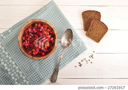 salad in a wooden bowl on a wooden background 27261917