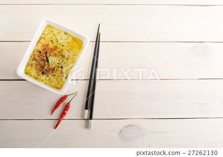 Instant noodles in a plastic bowl with chopsticks Instant noodles in a plastic bowl with chopsticks 27262130