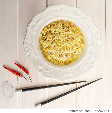 Instant noodles in bowl with chopsticks Instant noodles in bowl with chopsticks 27262131