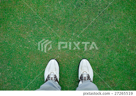 Golfer standing on green 27265519