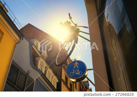 Bicycle with basket of flowers on the wall 27266820