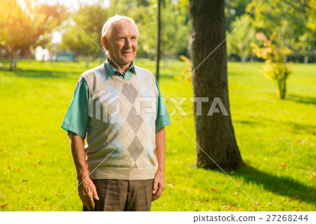 Senior man standing outdoor. Senior man standing outdoor. 27268244
