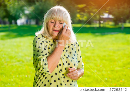 Old woman crying. 27268342