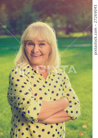 Smiling woman with crossed arms. Smiling woman with crossed arms. 27269045
