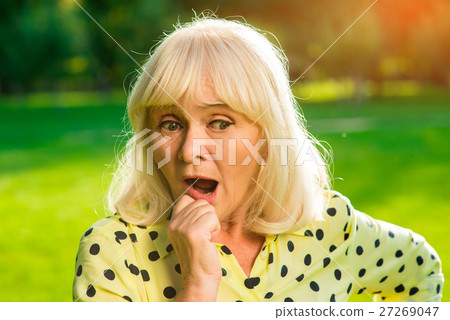 Lady holding her chin. Lady holding her chin. 27269047