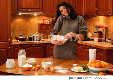 Young woman baking at home 27270792