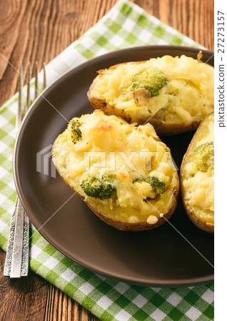 Twice baked potatoes stuffed with broccoli 27273157