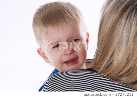 little crying boy on moms shoulder 27273231