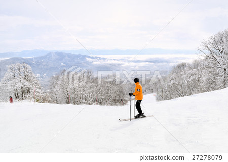 Skier taking in the beautiful Myoko scenery before Skier taking in the beautiful Myoko scenery before 27278079