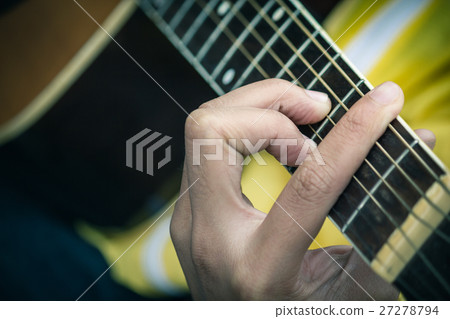 closeup of man's hands playing acoustic guitar closeup of man's hands playing acoustic guitar 27278794