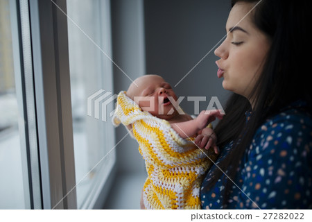 young mother with newborn baby young mother with newborn baby 27282022