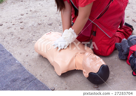Female paramedic showing CPR 27283704