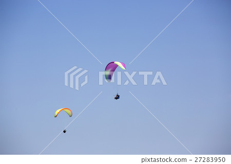 Colorful paragliders with blue sky Colorful paragliders with blue sky 27283950