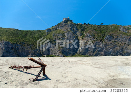 Old rusted anchor on the beach 27285235