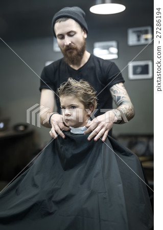 Little kid in barbershop 27286194