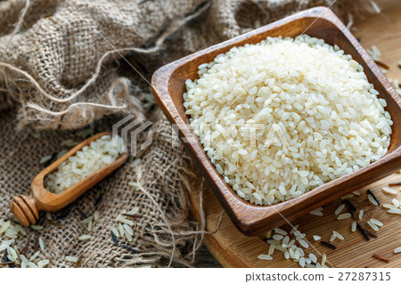Bowl full of white rice close up. Bowl full of white rice close up. 27287315