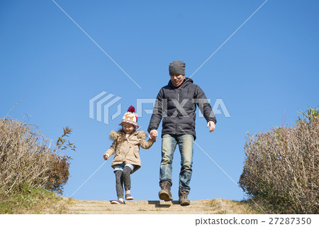 Parent and child playing in the park Parent and child playing in the park 27287350