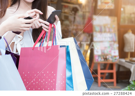 Woman hand shopping using smartphone Woman hand shopping using smartphone 27288424