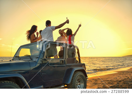 Five young people having fun in convertible car at Five young people having fun in convertible car at 27288599