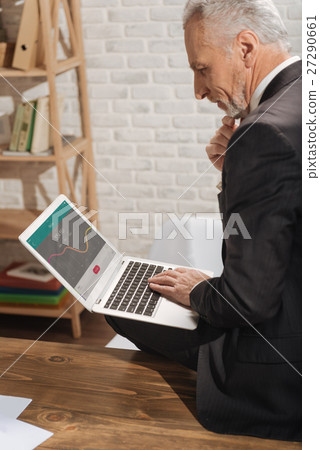 Competent specialist looking at the picture 27290661