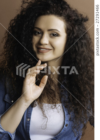 Portrait of confident girl touching her chin 27291466