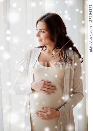 happy pregnant woman with big tummy at home happy pregnant woman with big tummy at home 27294371