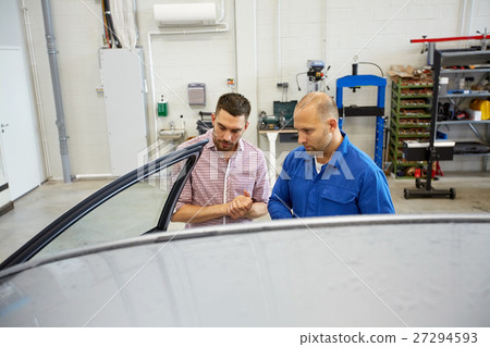 auto mechanic and man at car shop 27294593