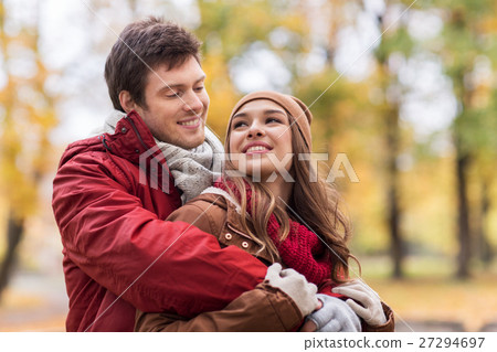 happy young couple hugging in autumn park happy young couple hugging in autumn park 27294697