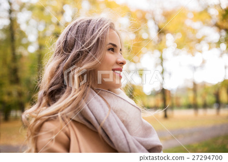 beautiful happy young woman smiling in autumn park 27294700