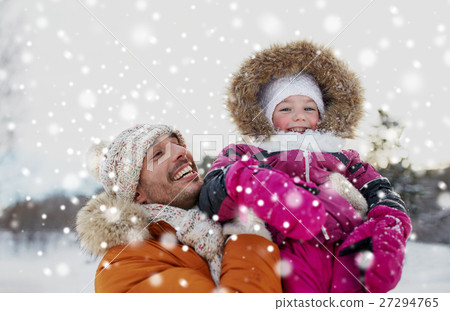happy family in winter clothes outdoors 27294765