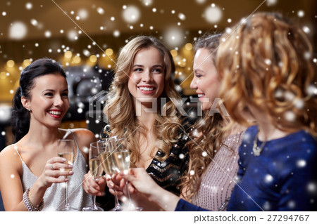 happy women with champagne glasses at night club 27294767