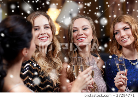 happy women with champagne glasses at night club 27294771
