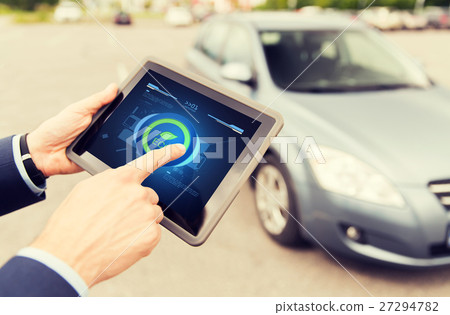 close up of male hands with tablet pc and car 27294782